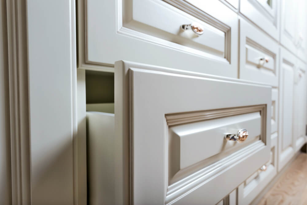 A semi-custom kitchen with light cabinetry and stone countertops in a Nashville home